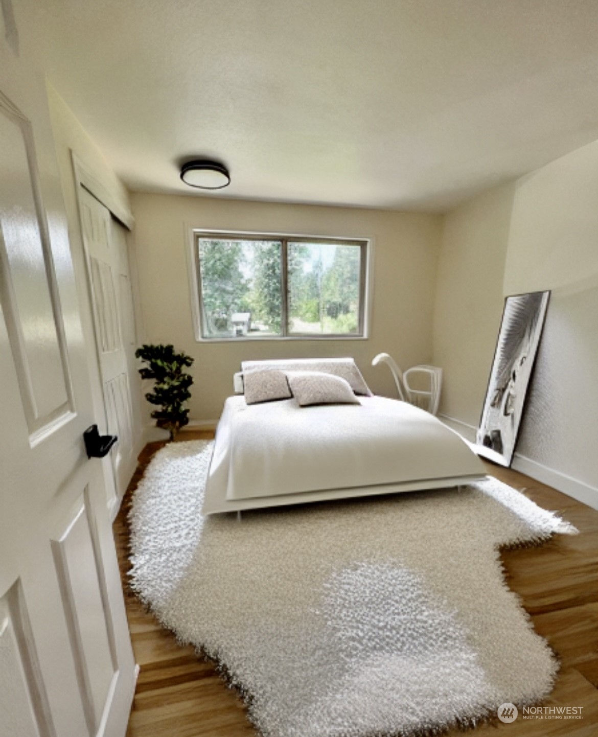 22925 49th Avenue Southeast Bothell, WA 98021 - Photo 21 of 40 a bedroom with a bed and wooden floor