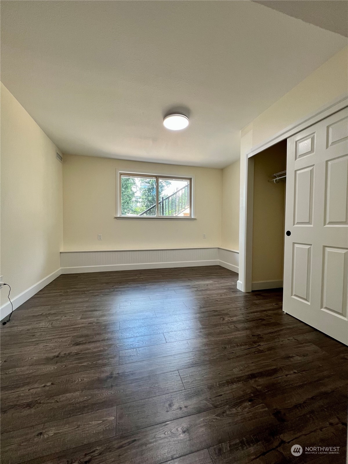 22925 49th Avenue Southeast Bothell, WA 98021 - Photo 31 of 40 an empty room with wooden floor and windows