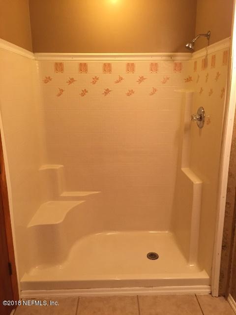 7391 Wheat Road Jacksonville, FL 32244 - Photo 13 of 26 a bathroom with a shower