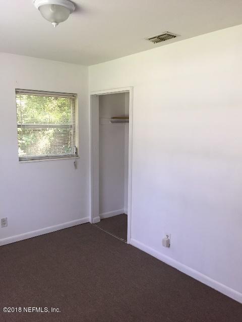 7391 Wheat Road Jacksonville, FL 32244 - Photo 16 of 26 an empty room with a window