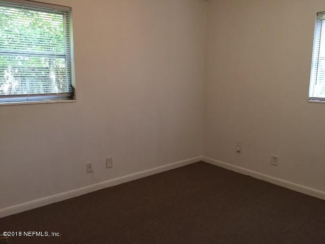 7391 Wheat Road Jacksonville, FL 32244 - Photo 17 of 26 an empty room with a window