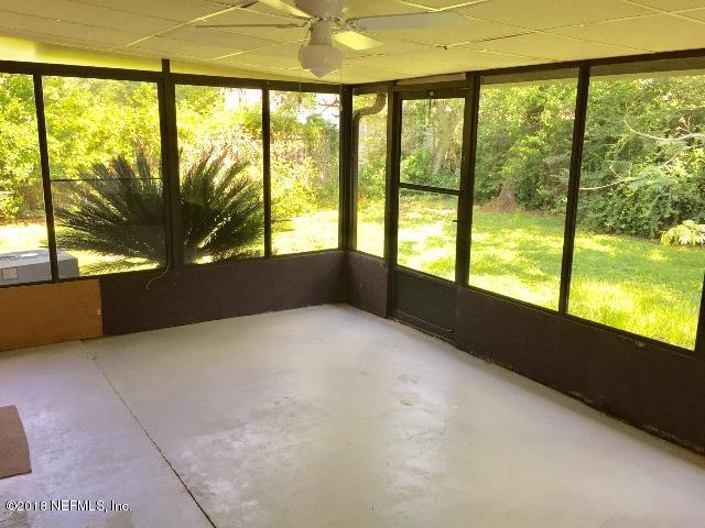 7391 Wheat Road Jacksonville, FL 32244 - Photo 19 of 26 a view of an empty room with a large window