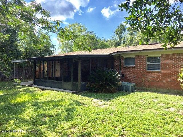7391 Wheat Road Jacksonville, FL 32244 - Photo 20 of 26 a view of a house with a yard and sitting area