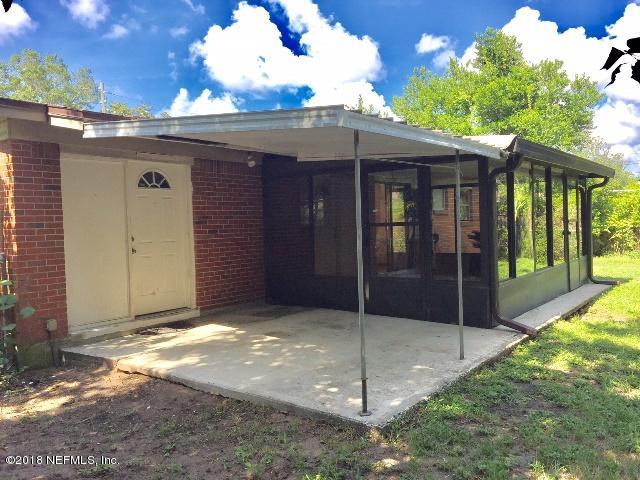 7391 Wheat Road Jacksonville, FL 32244 - Photo 21 of 26 a view of backyard with tub and wooden fence