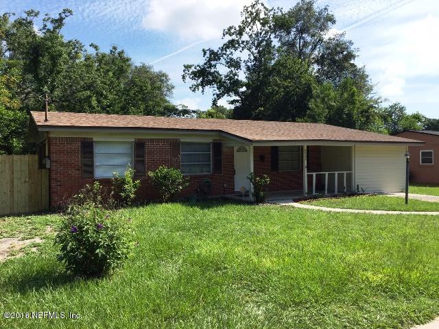 7391 Wheat Road Jacksonville, FL 32244 - Photo 26 of 26 a front view of a house with a garden