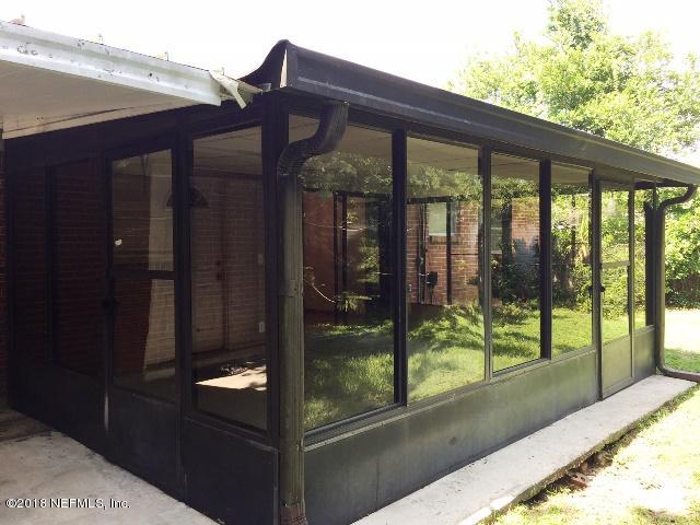 7391 Wheat Road Jacksonville, FL 32244 - Photo 5 of 26 a view of a house with a large window