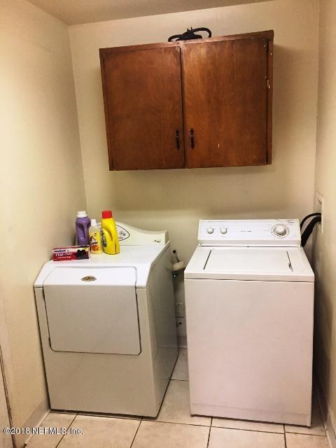 7391 Wheat Road Jacksonville, FL 32244 - Photo 9 of 26 a utility room with dryer and washer