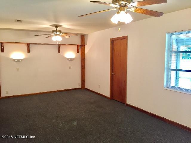 7391 Wheat Road Jacksonville, FL 32244 - Photo 10 of 26 a view of an empty room with a window