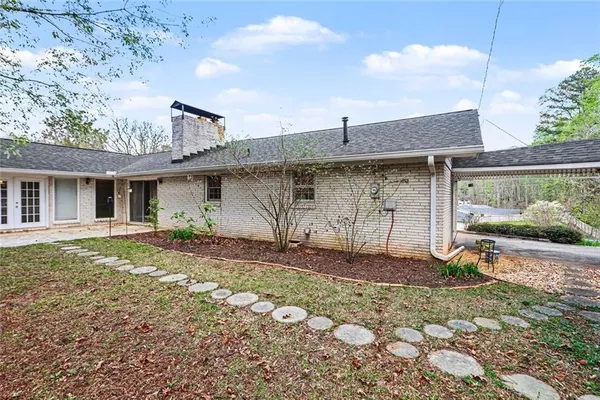 a front view of a house with garden