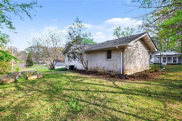 a backyard of a house with lots of green space