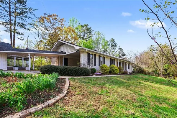 front view of a house with a yard