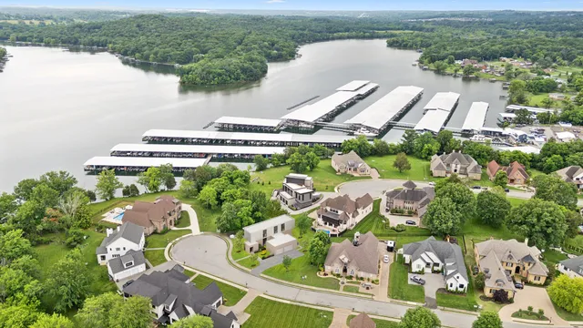 an aerial view of a house with a lake view