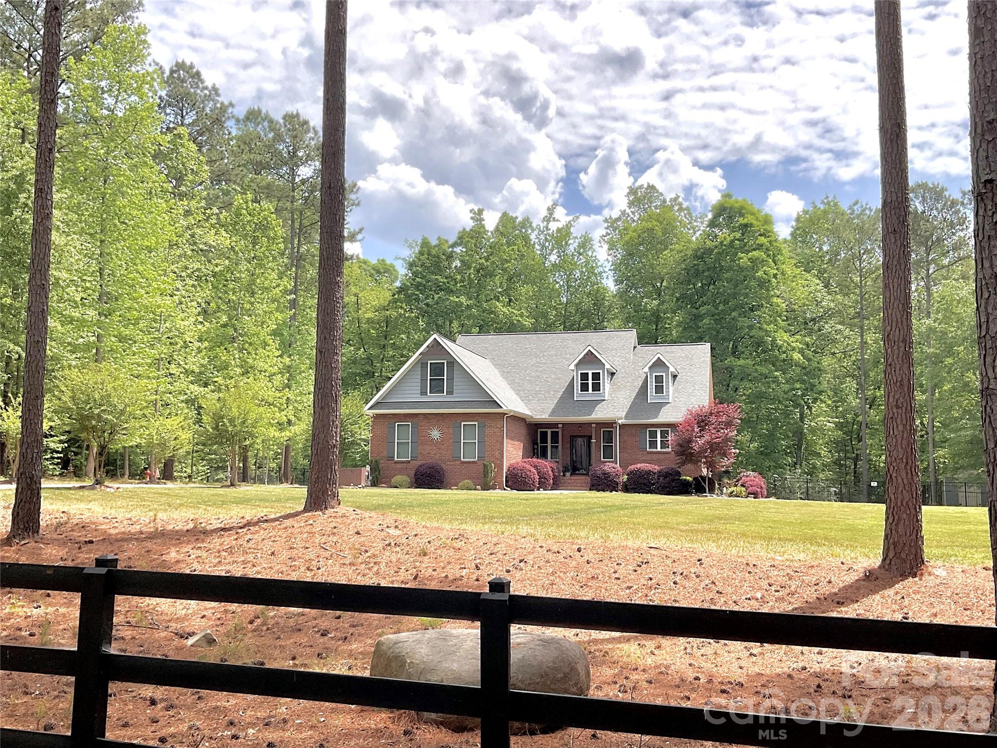 790 Brandon Road Clover, SC 29710 - Photo 4 of 43 a view of a house with a big yard and large tree