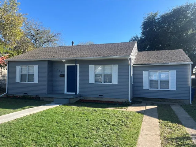 a view of a house with a garden