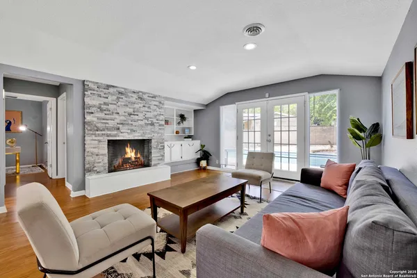 a living room with furniture and a fireplace