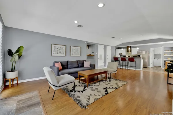 a living room with furniture and a rug