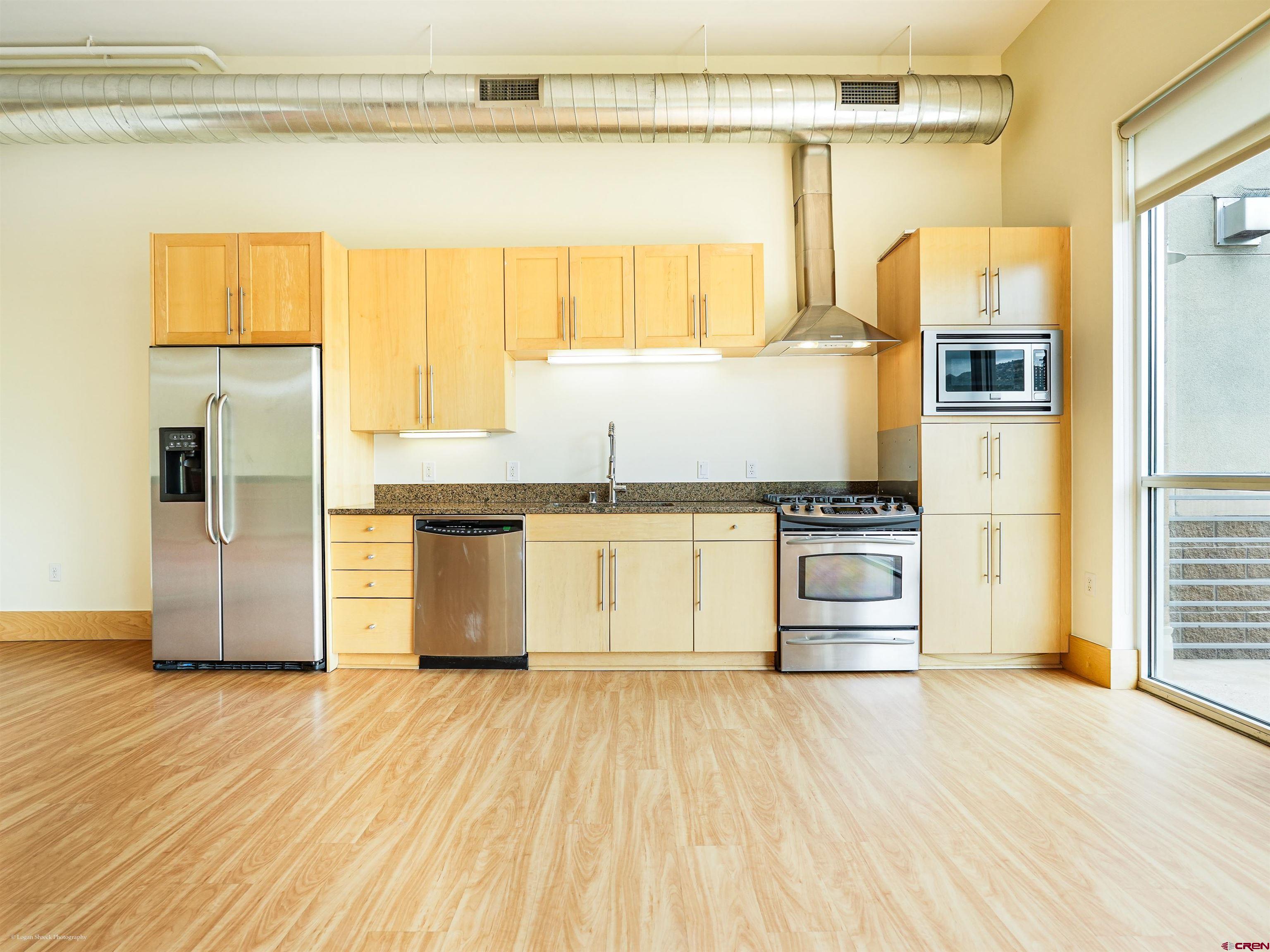 555 Rivergate Lane, Unit B2139 Durango, CO 81301 - Photo 14 of 32 a kitchen with a refrigerator and window