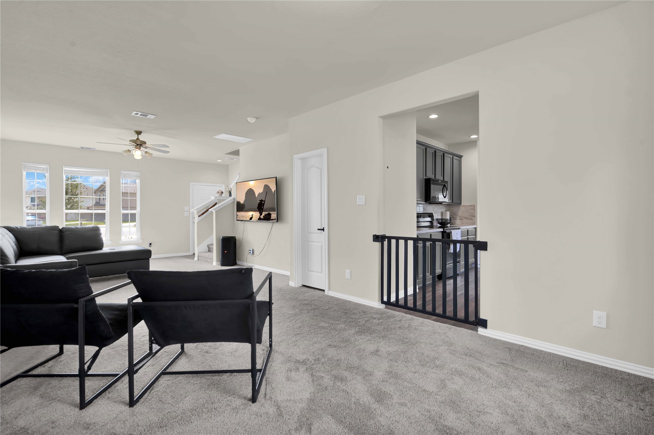 17703 Lion Heart Road Conroe, TX 77306 - Photo 6 of 26 a view of a livingroom with furniture and a flat screen tv