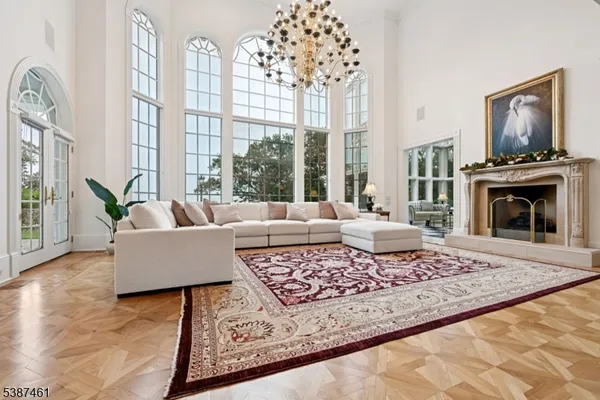 a living room with furniture windows and a fireplace