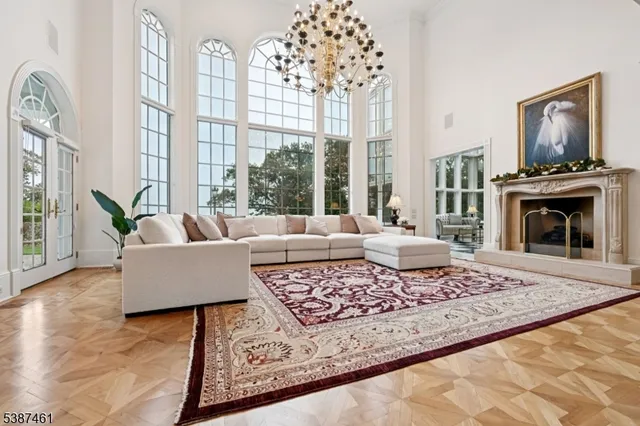 a living room with furniture windows and a fireplace