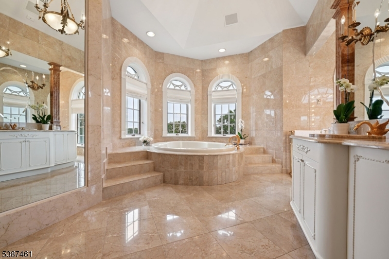 50 Laura Drive Cedar Grove, NJ 07009 - Photo 32 of 50 a large spacious bathroom with a large tub and shower