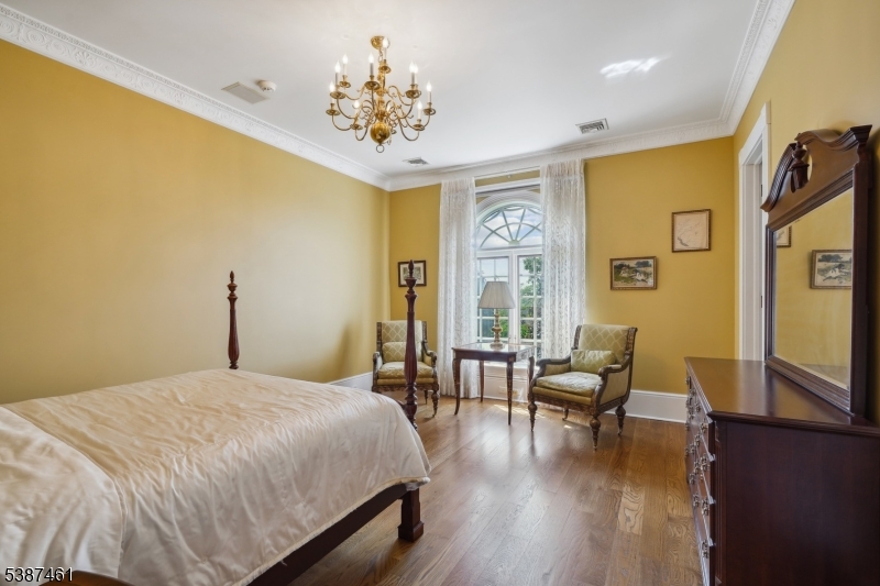 50 Laura Drive Cedar Grove, NJ 07009 - Photo 39 of 50 a spacious bedroom with a bed and wooden floor