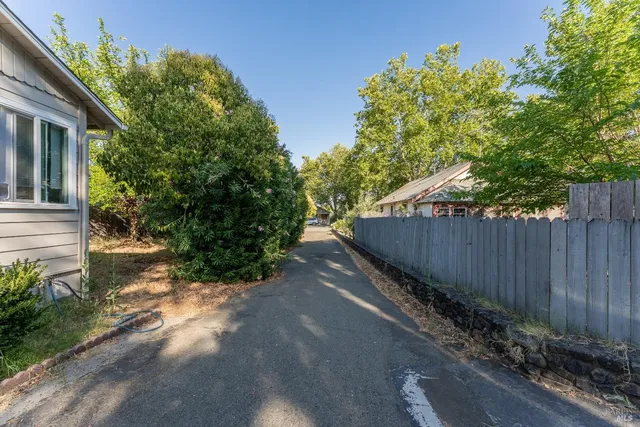a bathroom with a sink mirror and toilet