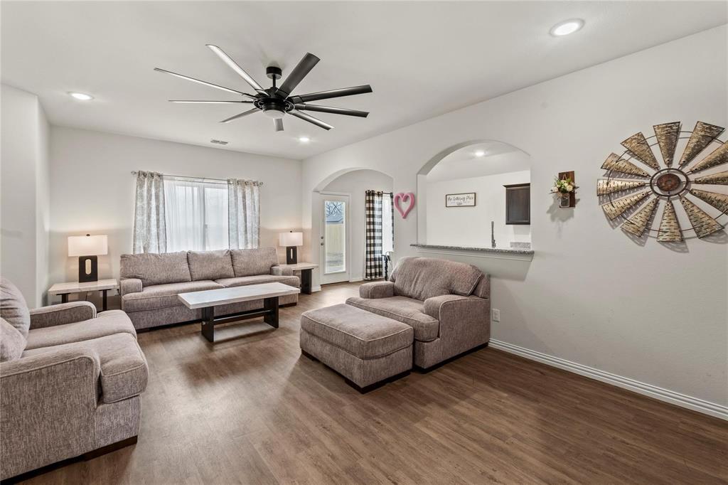 115 Oak Spgs Loop Mabank, TX 75147 - Photo 7 of 15 Living room featuring a ceiling fan, recessed lighting, and dark wood-style floors