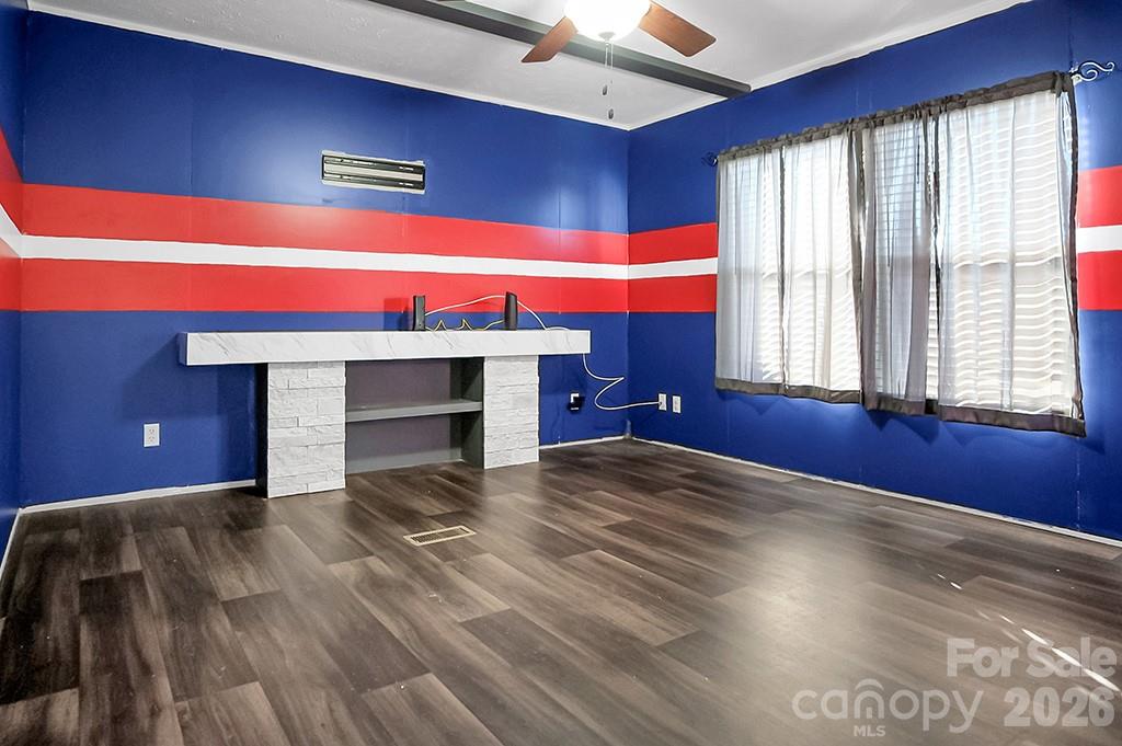 101 Park Lane Grover, NC 28073 - Photo 12 of 28 a view of empty room with a fireplace and fan
