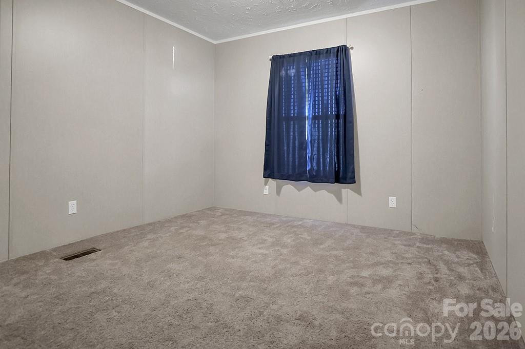 101 Park Lane Grover, NC 28073 - Photo 15 of 28 a view of an empty room with wooden floor and closet