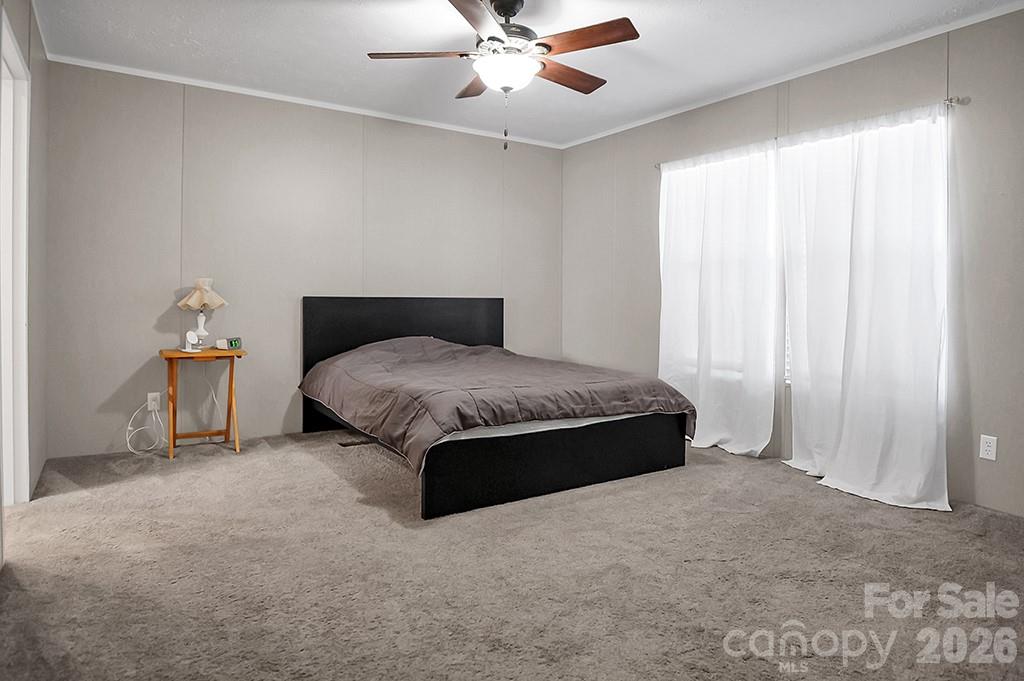 101 Park Lane Grover, NC 28073 - Photo 17 of 28 a spacious bedroom with a bed and window