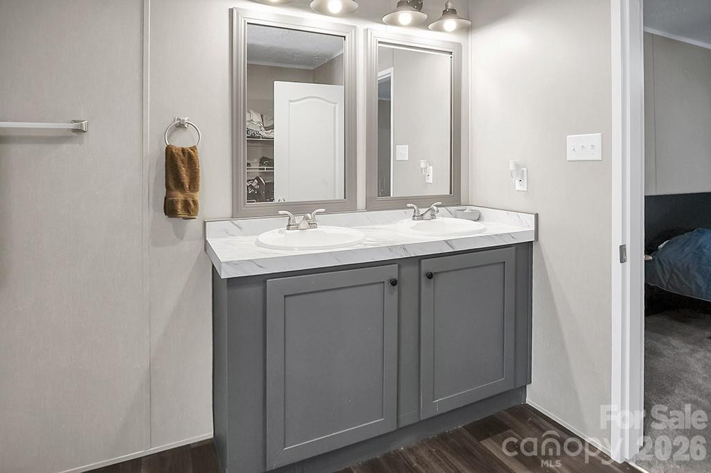101 Park Lane Grover, NC 28073 - Photo 21 of 28 a en suite bathroom with a sink and a mirror
