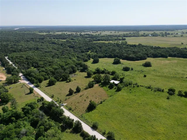 an aerial view of mountain with trees