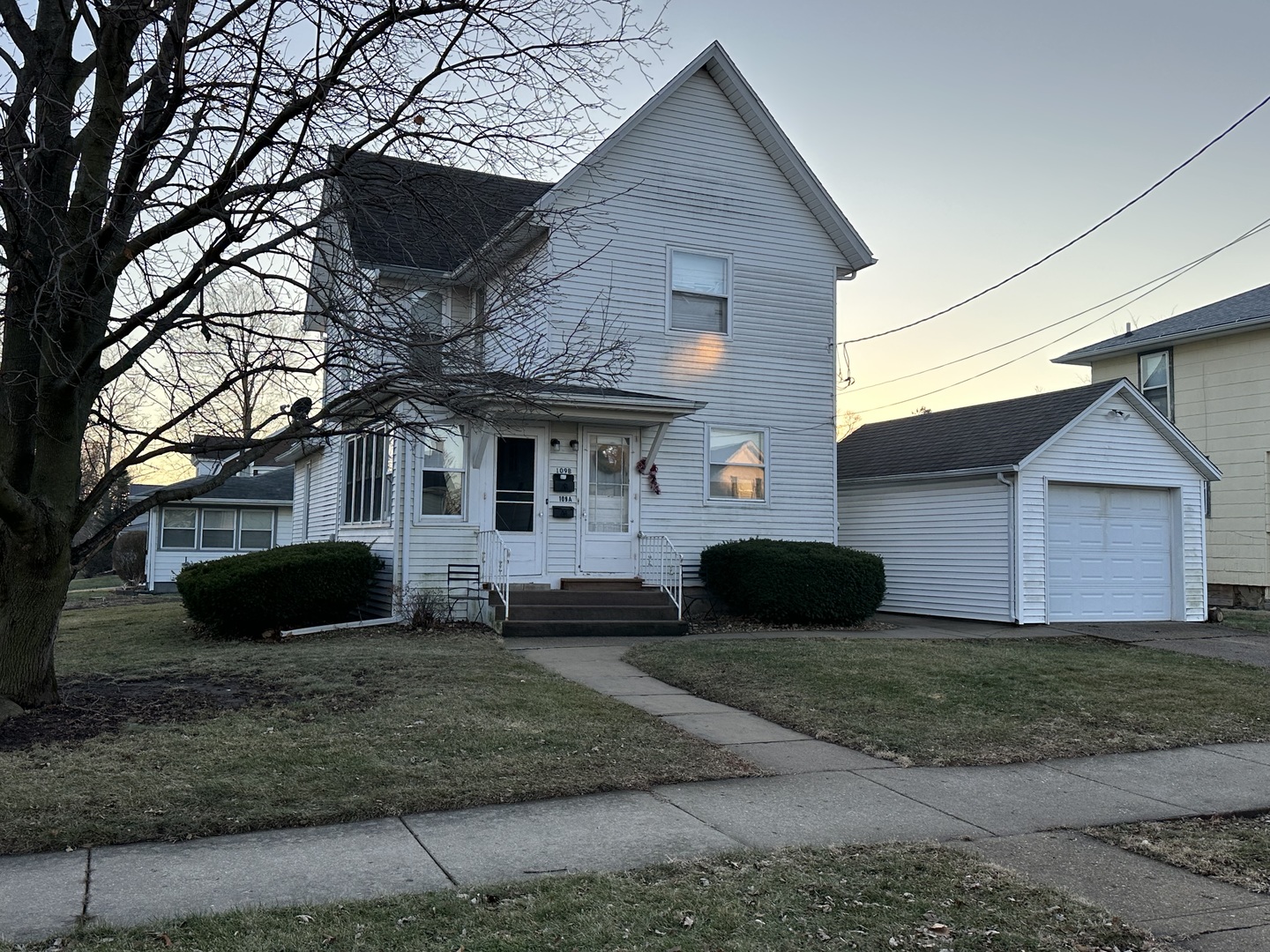 109 East Morris Street Morrison, IL 61270 - Photo 1 of 14 a front view of a house with a yard