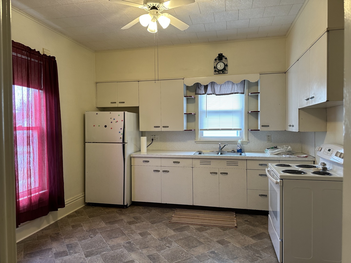 109 East Morris Street Morrison, IL 61270 - Photo 2 of 14 a kitchen with stainless steel appliances granite countertop a stove a sink and a refrigerator