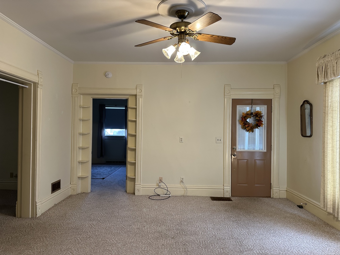 109 East Morris Street Morrison, IL 61270 - Photo 3 of 14 wooden floor in an empty room with a window