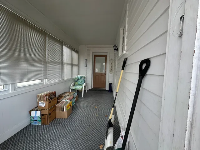 a view of a hallway with seating area