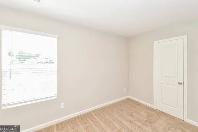 a view of an empty room and window