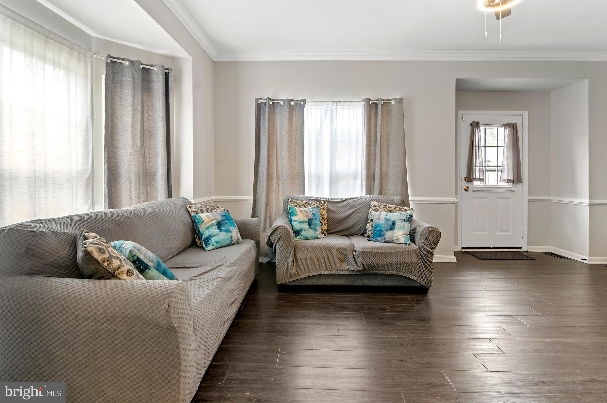 15511 Wylie Road Brandywine, MD 20613 - Photo 12 of 32 a living room with furniture and windows