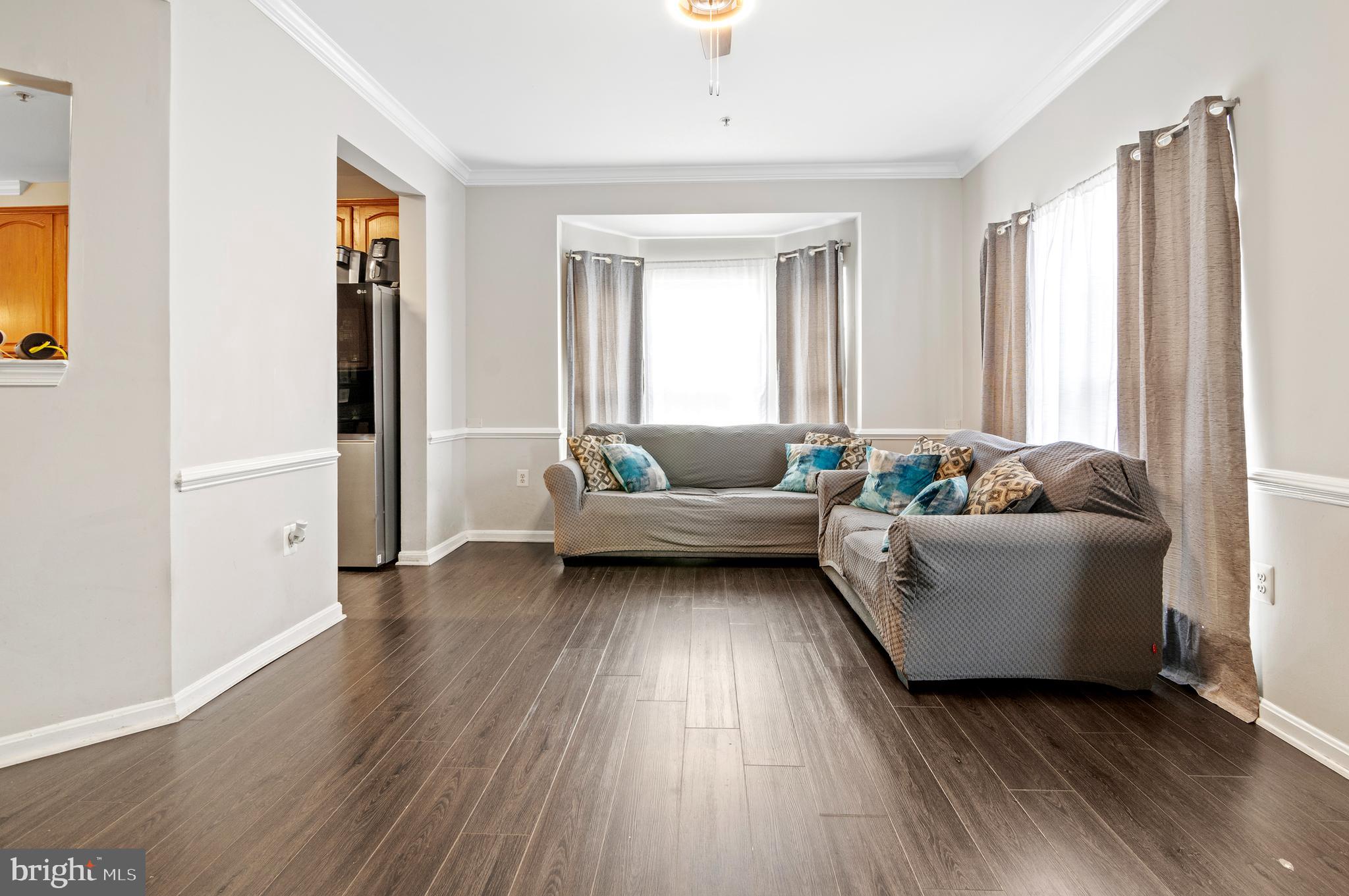 15511 Wylie Road Brandywine, MD 20613 - Photo 13 of 32 a living room with furniture and a large window