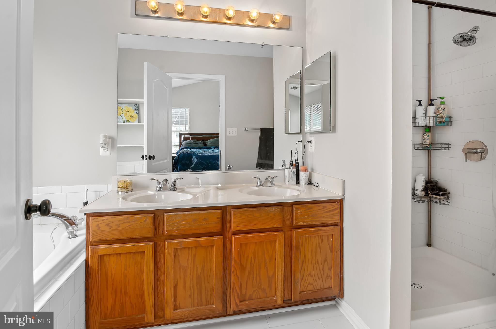 15511 Wylie Road Brandywine, MD 20613 - Photo 19 of 32 a bathroom with a granite countertop sink and a mirror