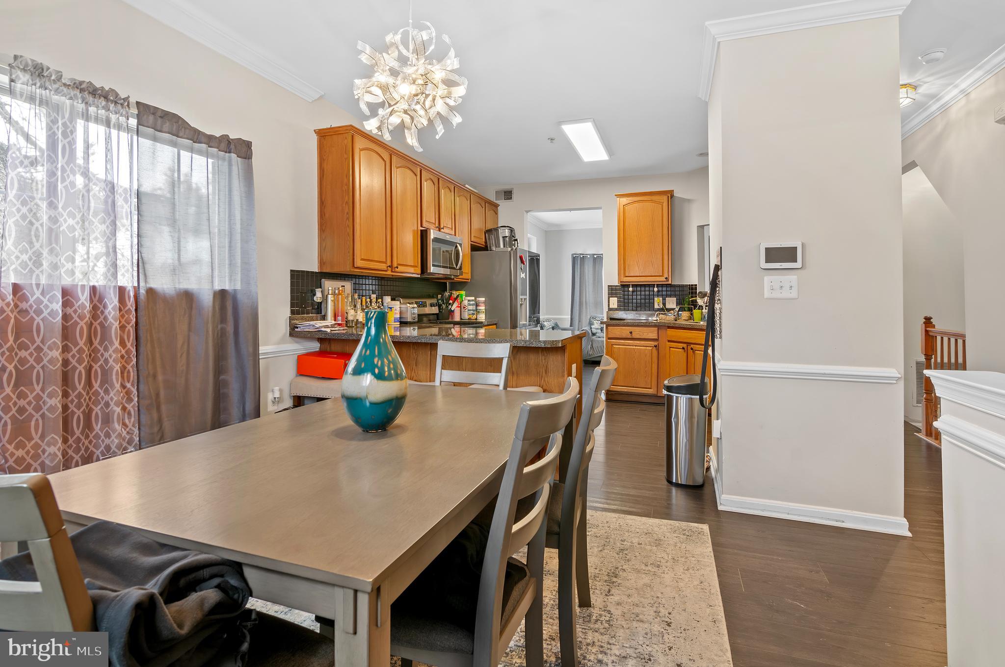 15511 Wylie Road Brandywine, MD 20613 - Photo 9 of 32 a view of a dining room with furniture and a window