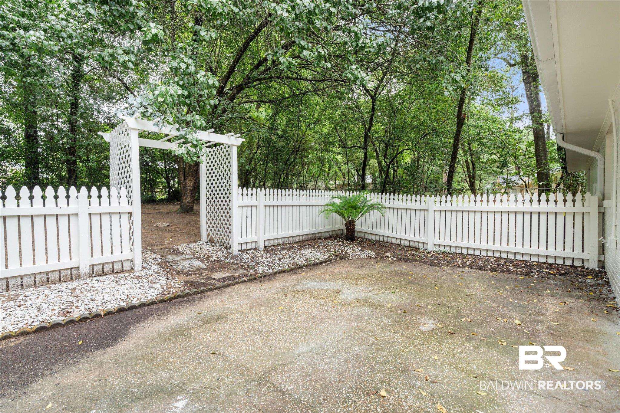 810 Nassau Drive Mobile, AL 36608 - Photo 18 of 31 View of patio featuring view of scattered trees