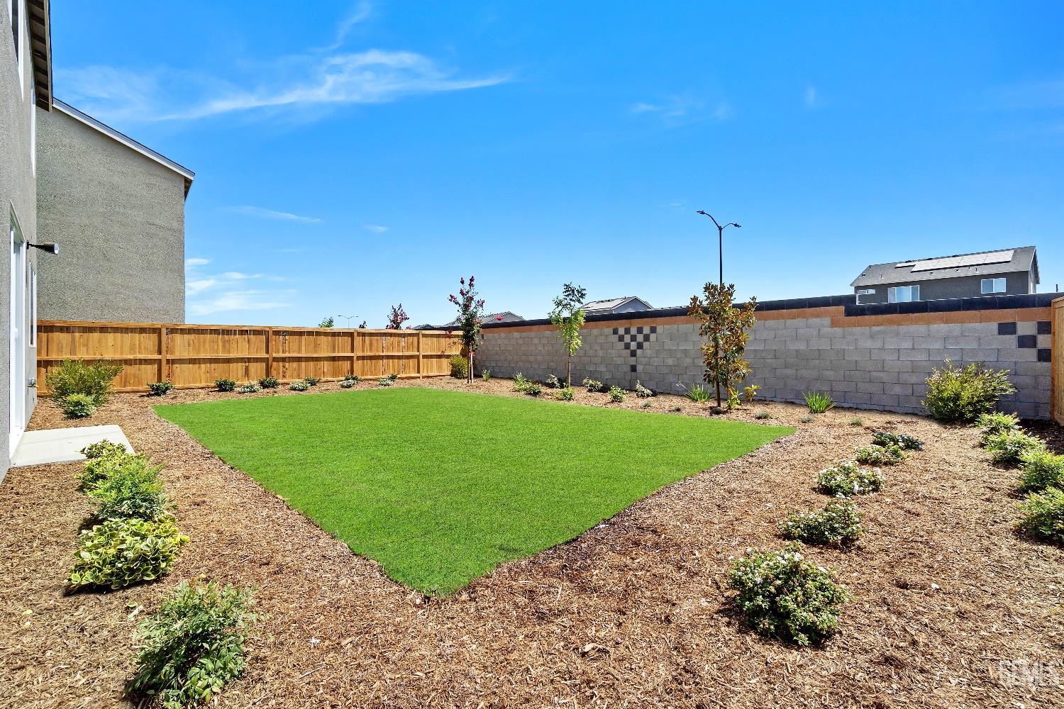 Undisclosed Address Shafter, CA 93263 - Photo 20 of 21 a view of a garden with a terrace