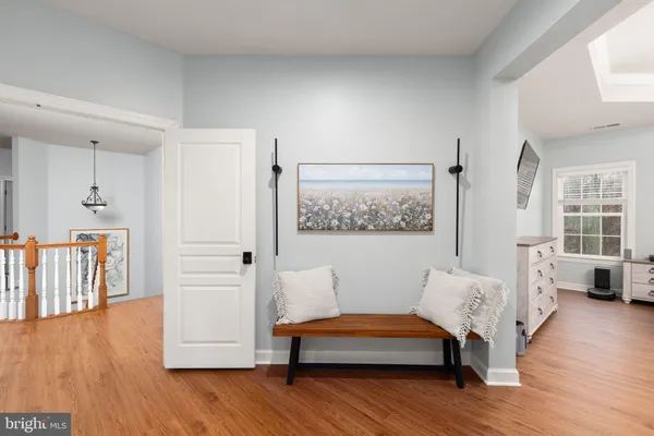 a reading room with furniture and wooden floor