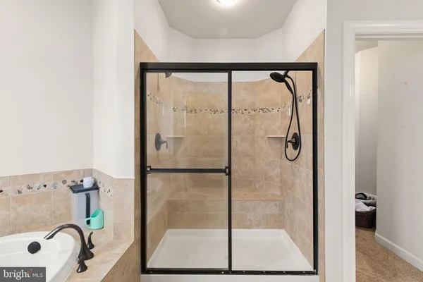 a bathroom with a shower and a sink