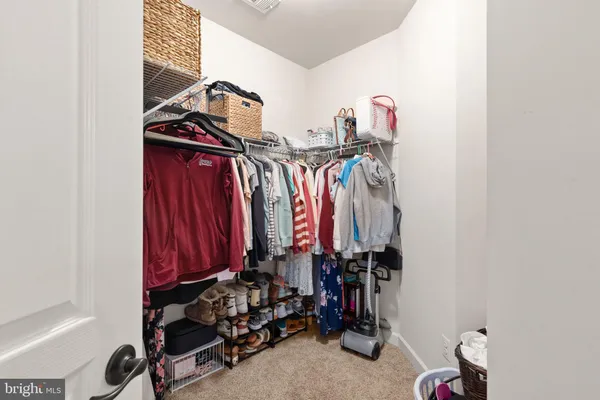 a view of a closet with storage
