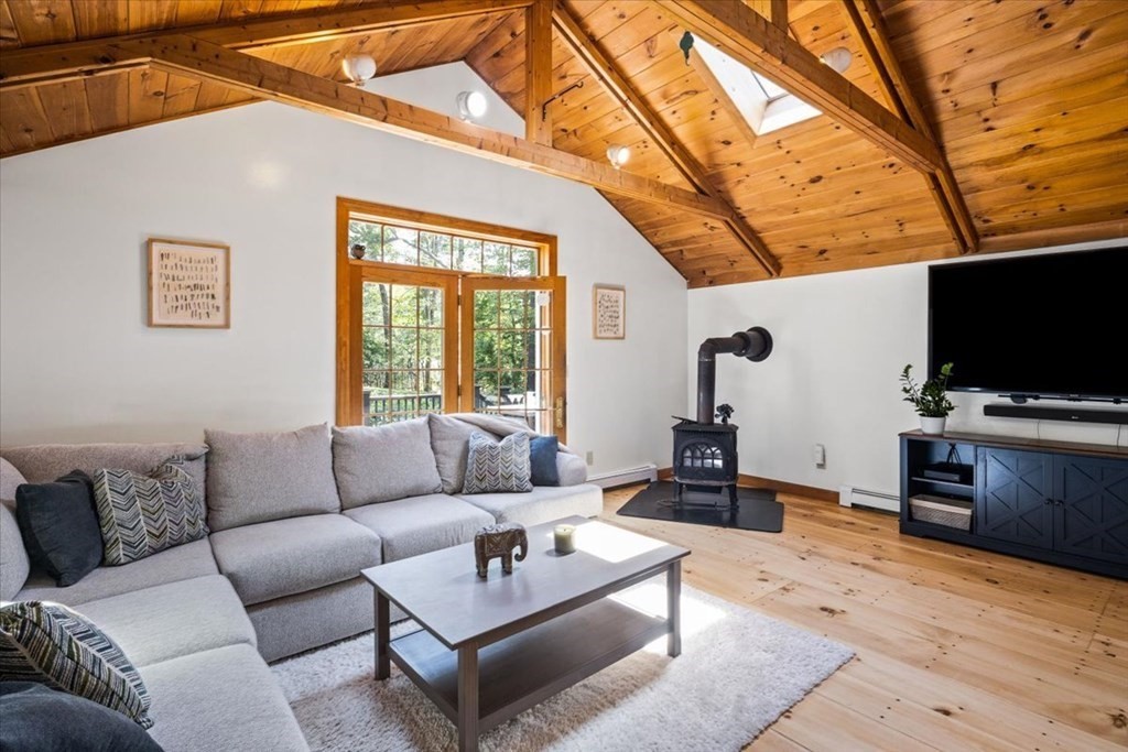 280 Broadway Hanover, MA 02339 - Photo 11 of 37 a living room with furniture and a flat screen tv