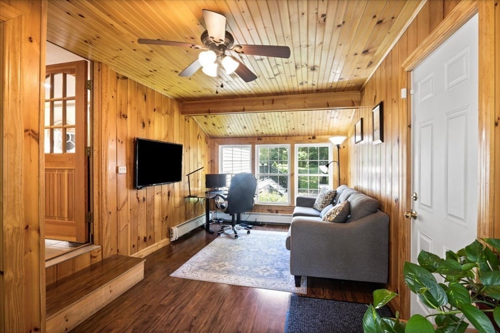 280 Broadway Hanover, MA 02339 - Photo 15 of 37 a living room with furniture and a flat screen tv