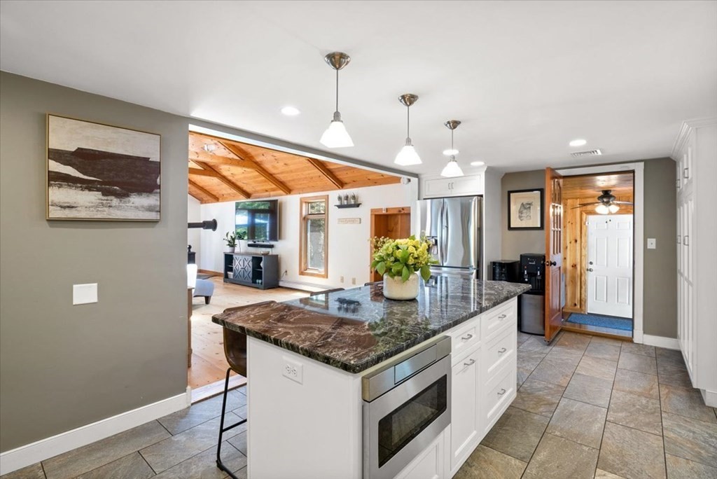 280 Broadway Hanover, MA 02339 - Photo 17 of 37 a kitchen with stainless steel appliances granite countertop sink stove and refrigerator